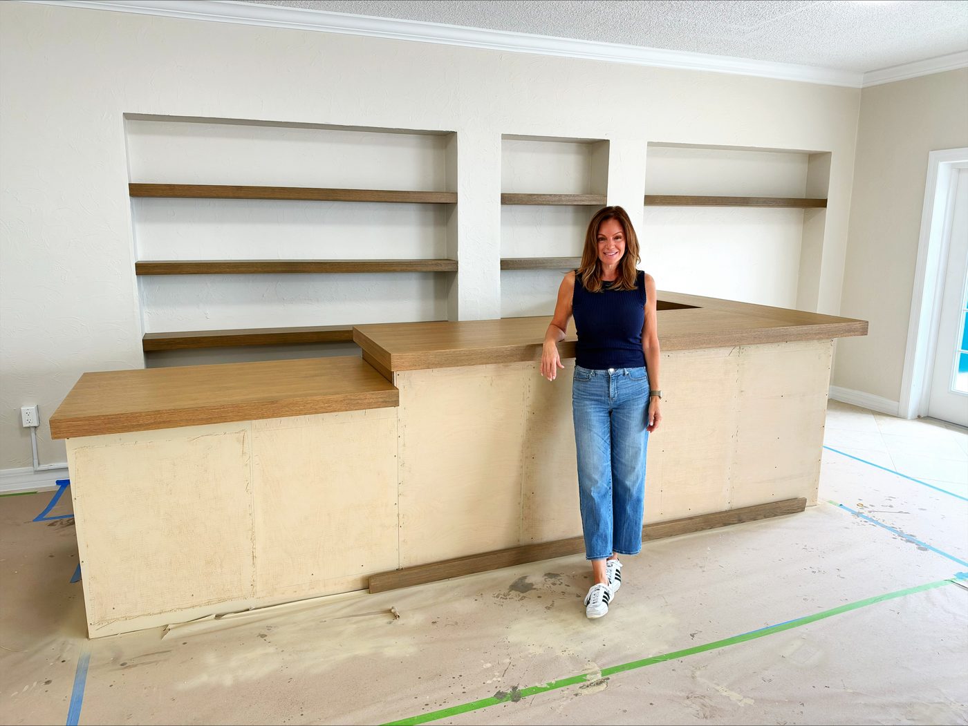 The wooden bar and shelves being built inside Naples Wine Company